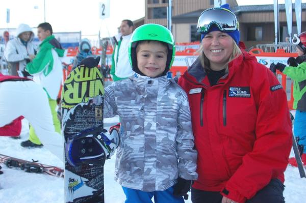 Ryder Quinn (6yrs) from Gold Coast Australia on opening day with Coronet Peak snowboard instructor Amanda Cataldo